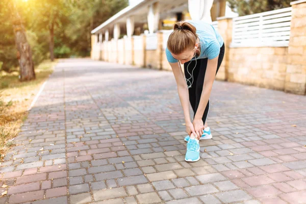 Pain in the leg of the girl after a sports run, morning training