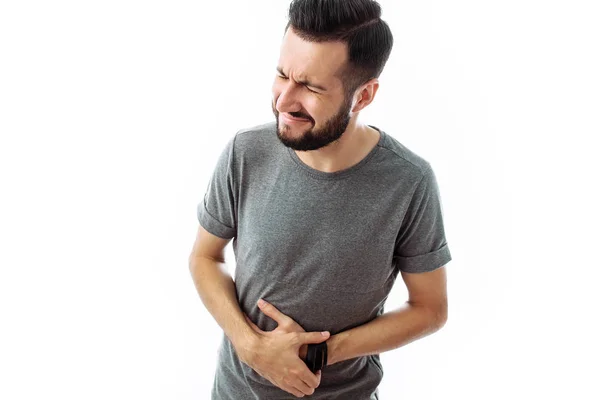 Imagen Joven Descontento Con Una Barba Una Camiseta Gris Con — Foto de Stock