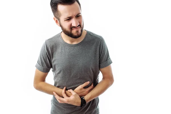 Imagen Joven Descontento Con Una Barba Una Camiseta Gris Con — Foto de Stock