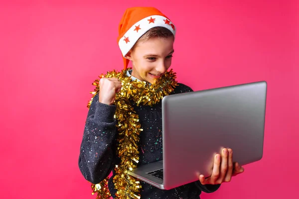 Happy Teenager Santa Hat Tinsel His Neck Looking Laptop Excited — Stock Photo, Image