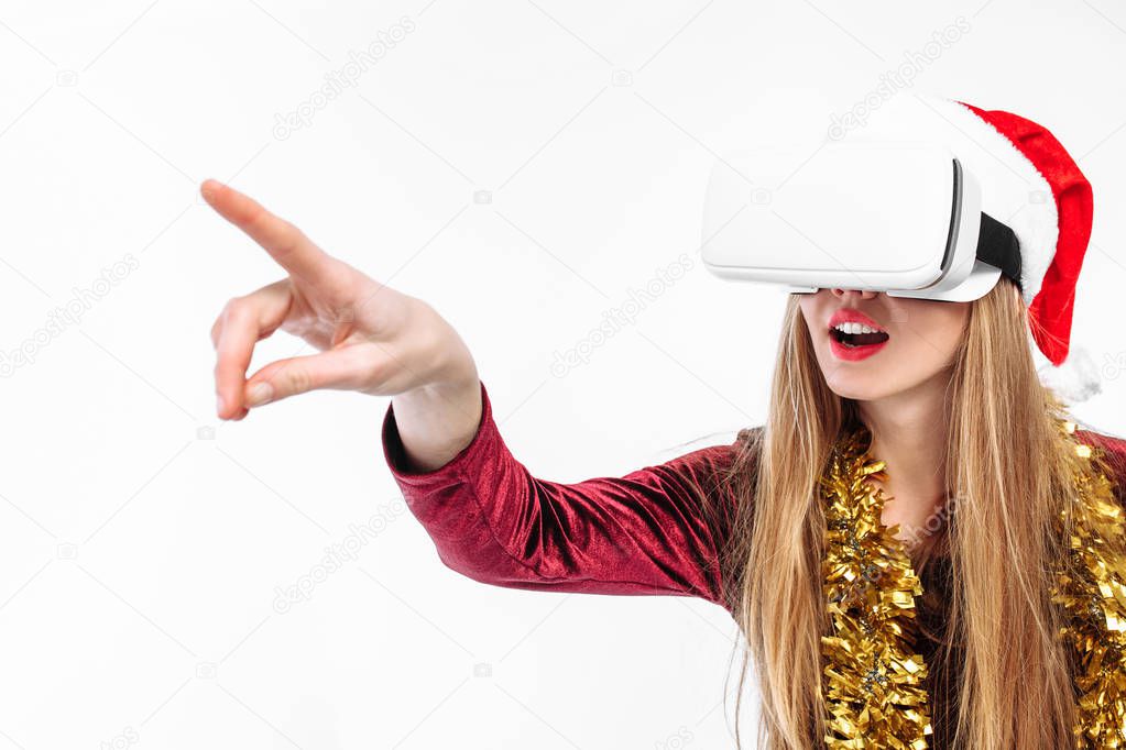 Portrait of a young girl in a Santa Claus hat with glasses, 3D glasses. on a white background.