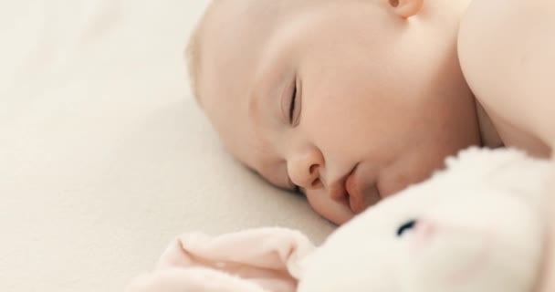 Funny baby sleeping on the bed at home. Childrens day lower sleeping position — Stock Video