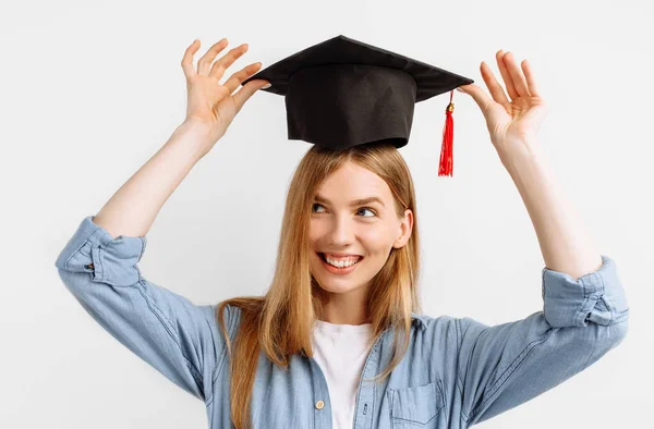 Happy Attractive Girl Graduate Happily Puts Graduation Hat Her Head — Stock Photo, Image