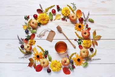 Apples, flowers and honey  on white wooden background with copy space. Concept for Rosh Hashanah, Jewish New Year, harvest festival, Lammas.