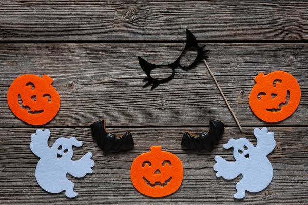 Silhouette of scary pumpkin, ghosts, black cat mask and bat