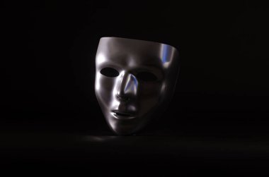 parlak metalik bir maske bir başlangıç siyah arka plan karşı vurgulanır