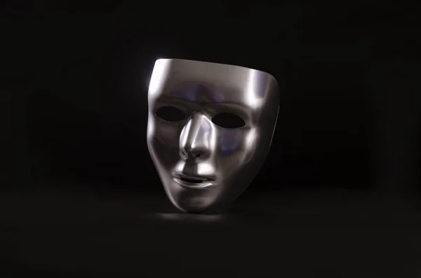 parlak metalik bir maske bir başlangıç siyah arka plan karşı vurgulanır