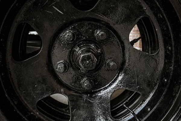 The wheel of the old Soviet military machine. In the park of the exhibits of military equipment