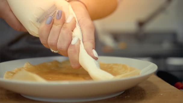 Squeezing Cream Baking Cook Bakes Pancakes — Stock Video