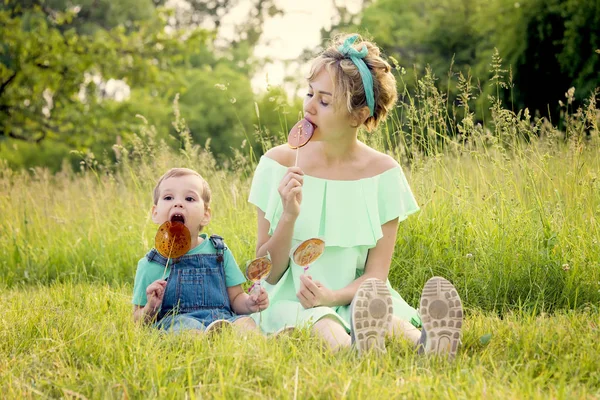 Mother Son Eat Candy Stick Rest Nature Spend Free Time — Stock Photo, Image