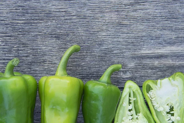 green bell pepper on a wooden background