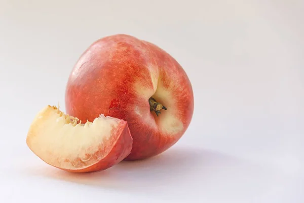 ripe peaches on a white background closeup