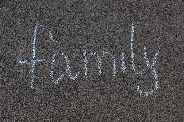 inscription on the asphalt family, chalk written