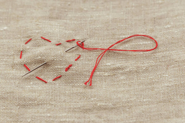 the composition of the seamstress, the tailor, the sewing thread and for knitting, the red thread is looped