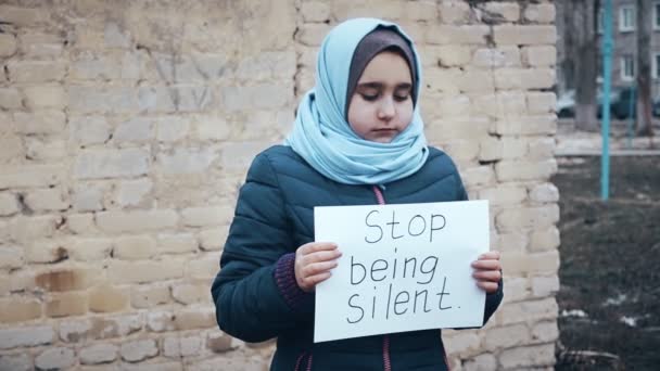 Refugee Girl Inscription White Sheet Stop Being Silent — Stock Video