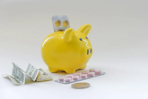 concept of expensive drugs. social problems. piggy bank