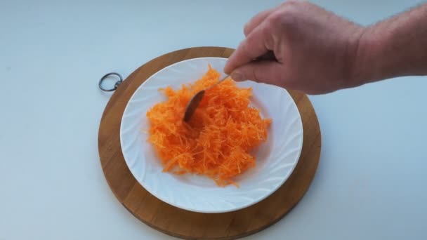 Grated Carrot Displayed White Plate Spoon — Stock Video