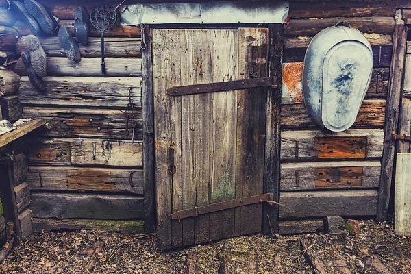 Old wooden door of a collapsed barn. — Stock Photo, Image