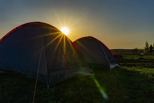 tourist tents in the evening at sunset