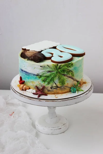Anniversary gift cake with the gingerbread number 30 with a tropical concept on the cake stand. Close up.