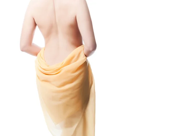 Espalda desnuda de una mujer. Aislado sobre fondo blanco — Foto de Stock