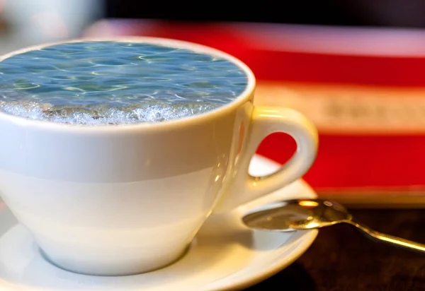 Sea surf in a cup of coffee — Stock Photo, Image