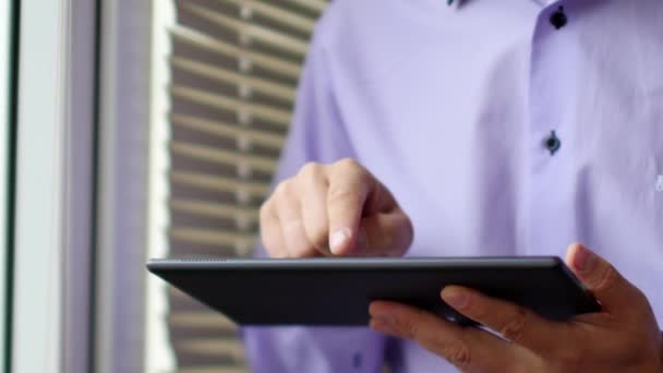 Businessman in shirt using modern digital tablet — Stock Video