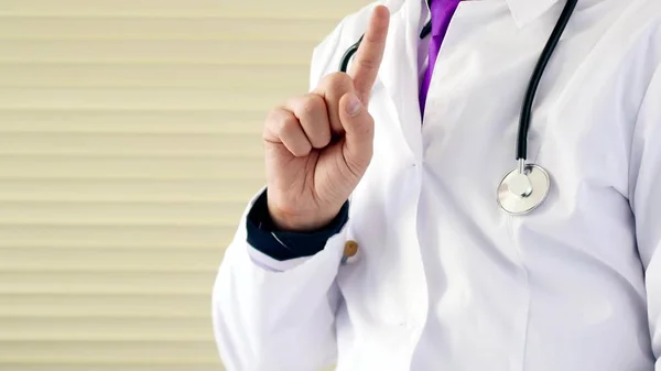 Doctor make no sign by his finger. He shows forbidden sign for medecine