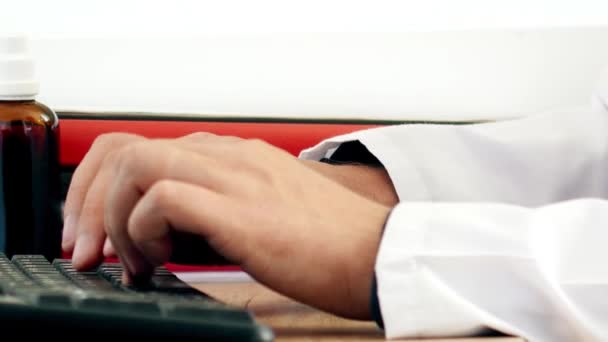 Medical doctor hands typing prescription on computer keyboard — Stock Video