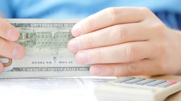 Man Counting Dollars Filling Tax Form Calculating Expenses Writing Tax — Stock Photo, Image