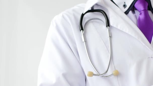 Closeup of male doctor hand writing a medical prescription. — Stock Video