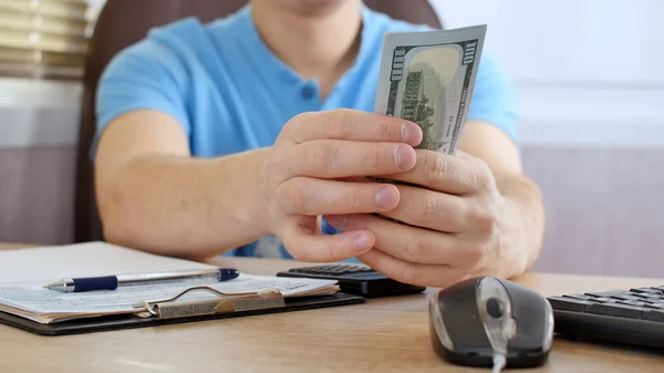 Man Blue Shirt Counting Dollars Filling Tax Form Calculating Expenses — Stock Photo, Image