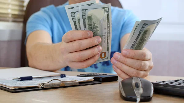 Man Blue Shirt Counting Dollars Filling Tax Form Calculating Expenses — Stock Photo, Image