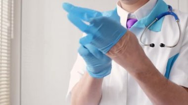 Medical doctor wearing latex gloves. Video Clip Latex gloves Stock Videos, Royalty Free Latex gloves Footages ...
