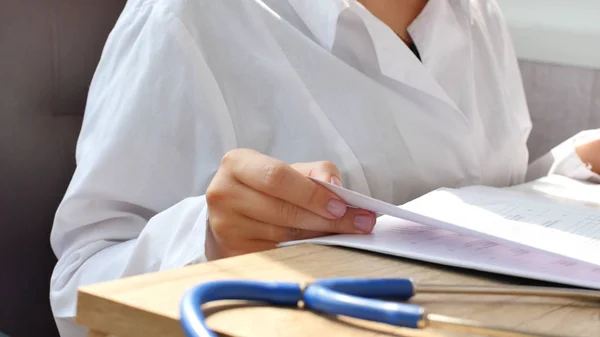 Doctor reading medical documents for medical research