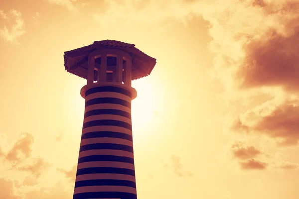 Lighthouse silhouette at sunset. — Stock Photo, Image