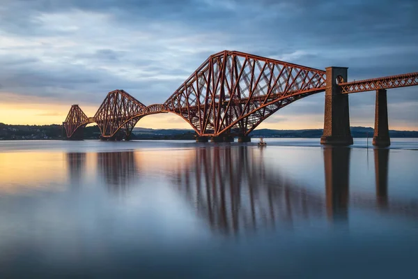 View of Forth Rail Bridge, the worlds longest cantilever bridge, at sunset on long exposure, Scotland, United Kingdom