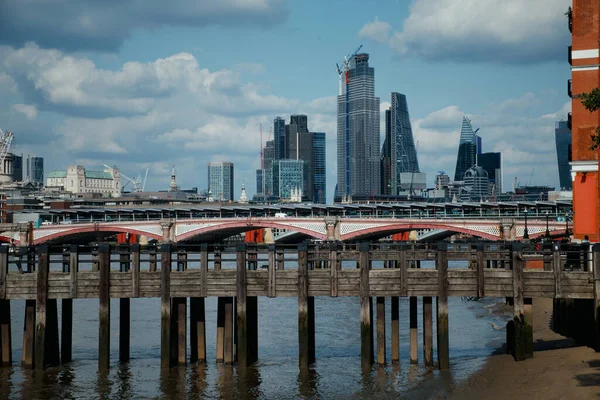 Wooden wharf and the City of London — Stock Photo, Image