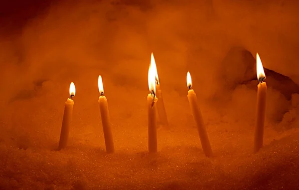 Burning candles in the snow, fire, candle, cold, heat, winter, paradox, cold in heat, heat in cold, poverty, poor