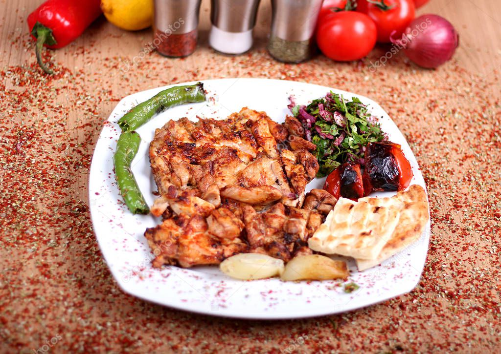 Grilled Chicken Serving on White Plate with Fresh Pepper and Sal