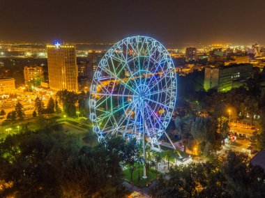 Rostov-on-Don, Russia - approx. August 2016: a view from the height of the Ferris wheel One Sky in the evening clipart