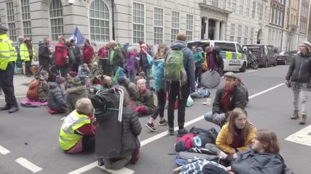 London, UK - October 7, 2019: Participants of the protest rally Extinction Rebellion on the streets of London — ストック動画