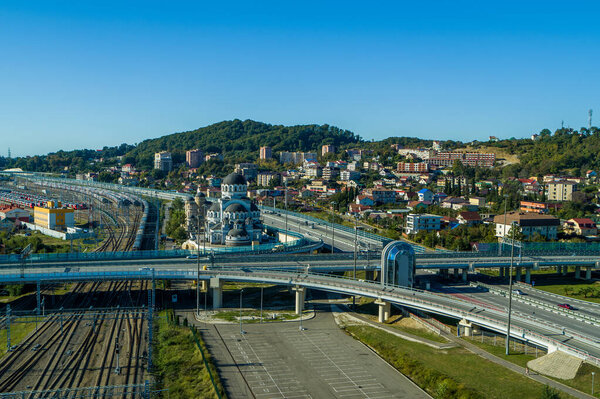 Sochi, Russia - October 2019: Orthodox church and road junction, aerial view