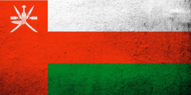 The Sultanate of Oman National flag. Grunge background