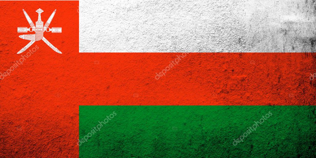 The Sultanate of Oman National flag. Grunge background