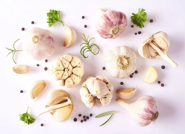 Food concept. Composition with fresh garlic, cilantro, basil and rosemary leaves and peppercorn isolated on white background — Stock Image Food Concept Composition Fresh Garlic Cilantro Basil Rosemary Leaves Peppercorn Royalty Free Stock Images