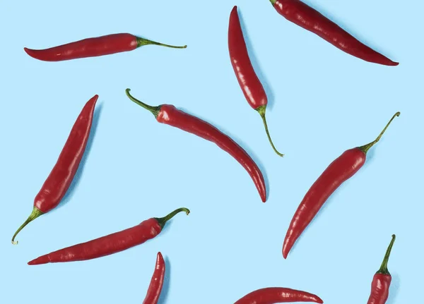 Flat Lay Red Chili Peppers Pattern Blue Background Top View — Stock Photo, Image