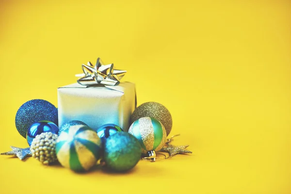 Christmas blue decoration on yellow background