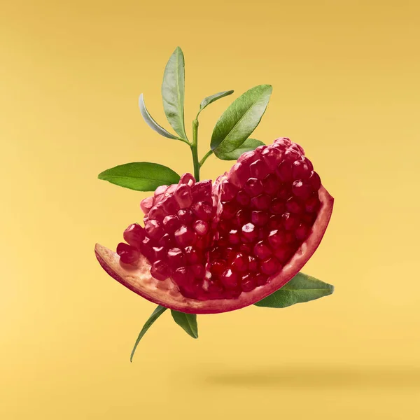 Flying Air Fresh Ripe Pomegranate Isolated Yellow Background High Resolution — Stock Photo, Image