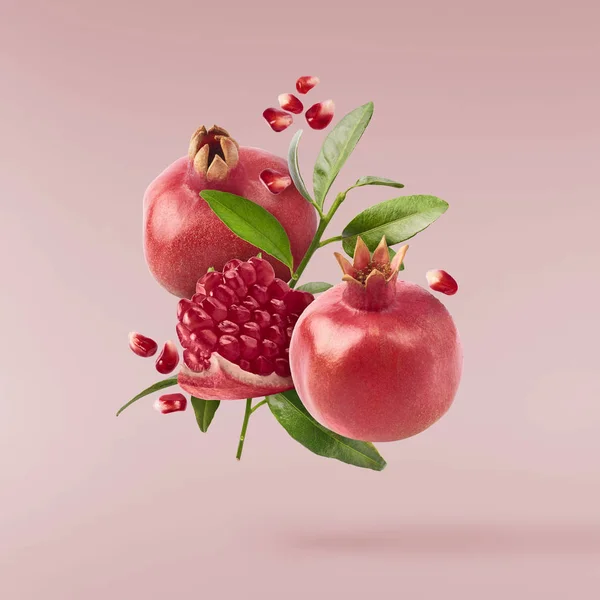 Flying Air Fresh Ripe Whole Cut Pomegranate Seeds Leaves Isolated — Stock Photo, Image